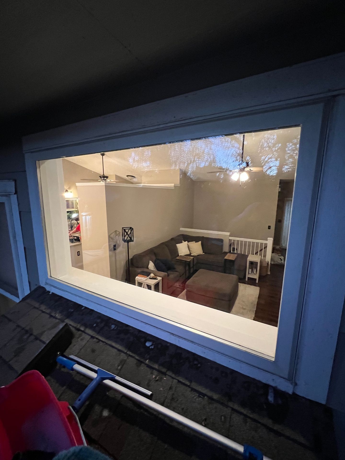 A picture of a clean window on a roof showing equipment of cleaning 