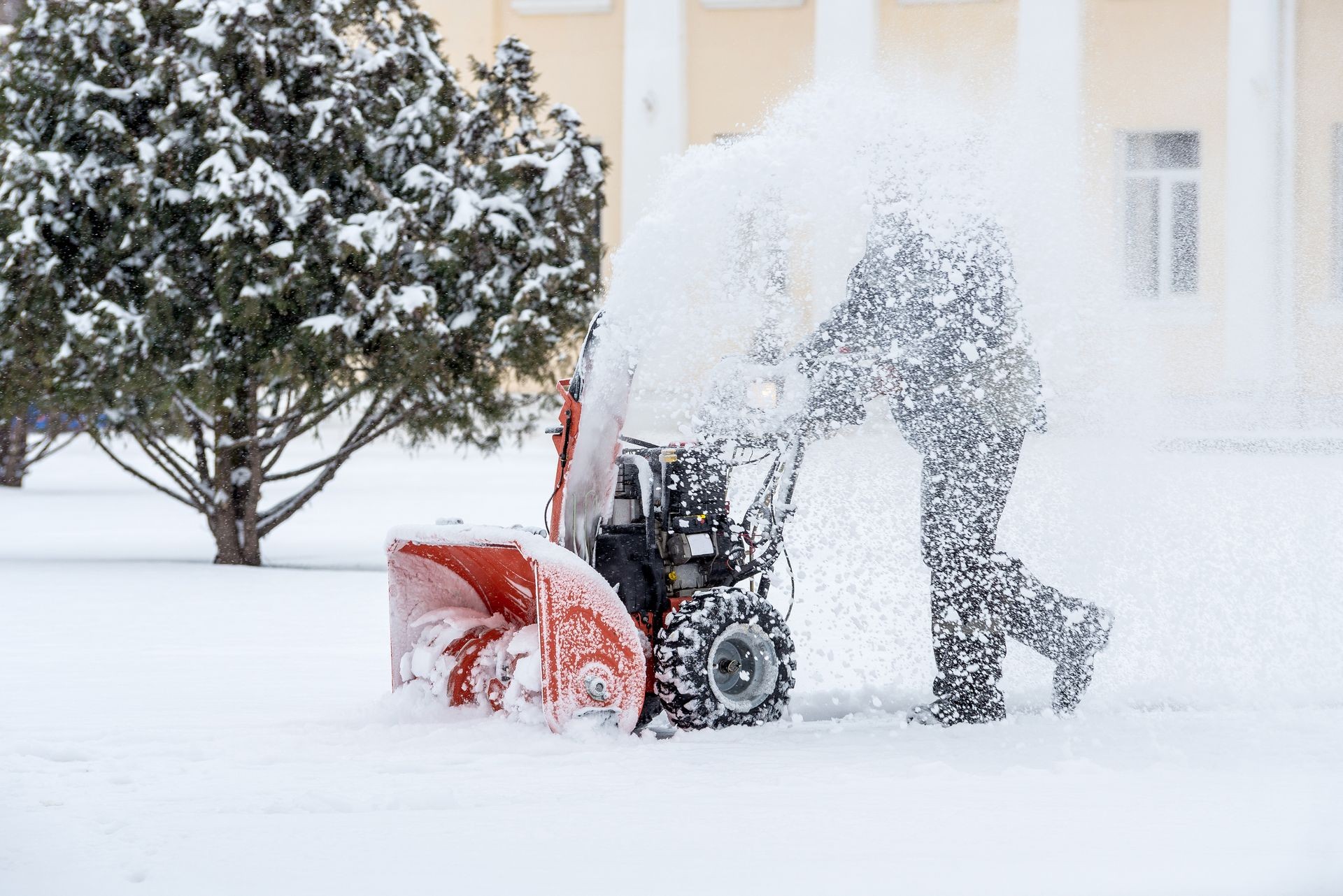 Snow-removal work with a snow blower. Man Removing Snow. heavy precipitation and snow piles