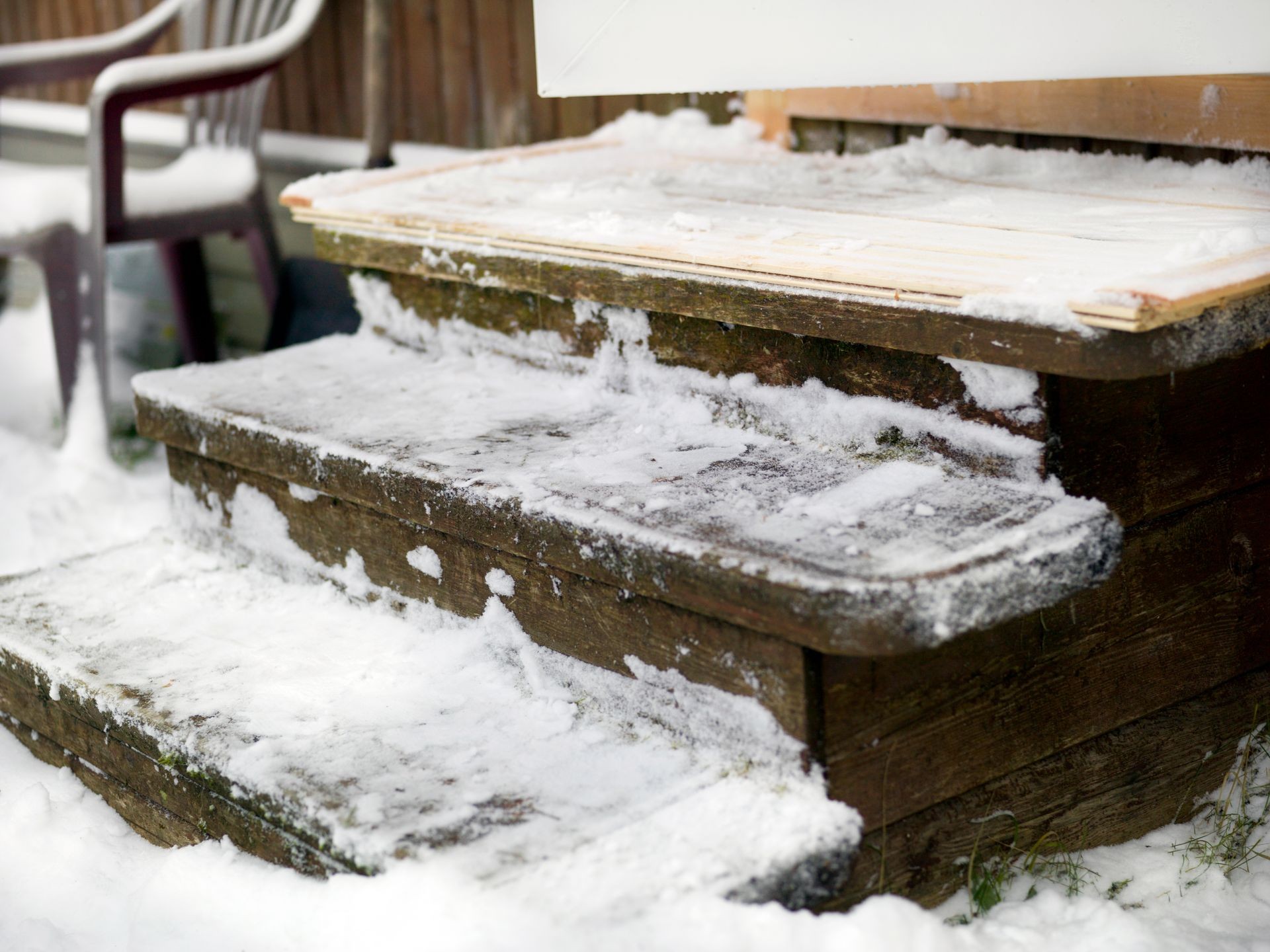 Wooden steps with snow and ice removed, outdoor closeup