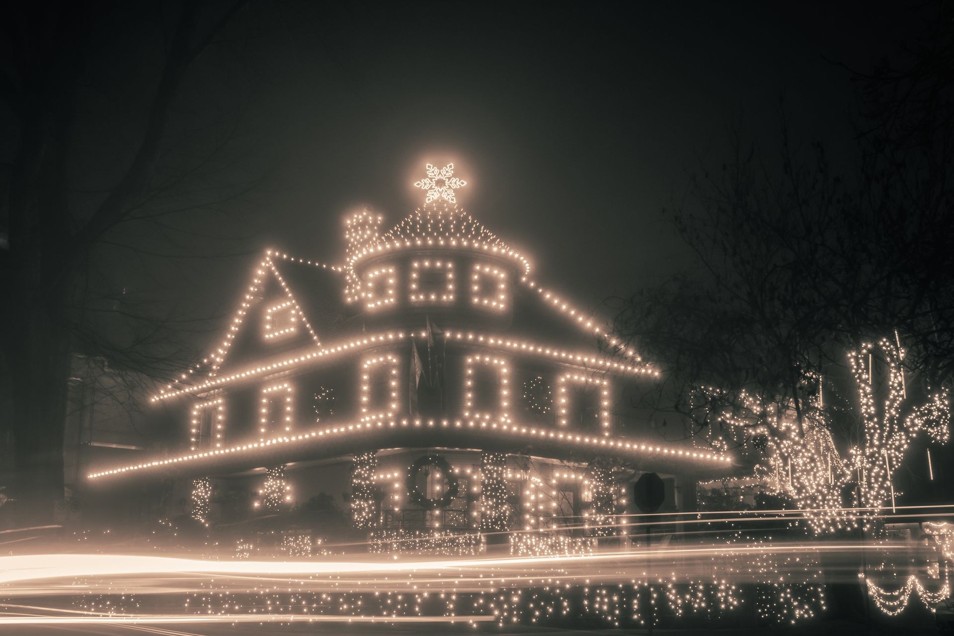 Christmas lights house decorations with foggy night backgrounds